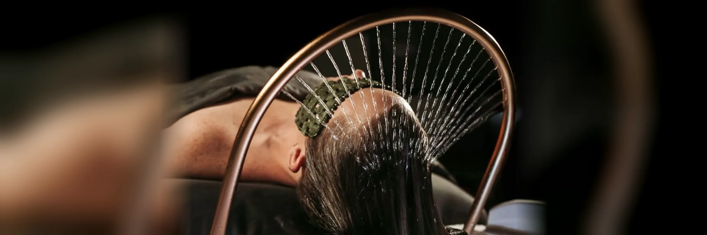 The waterfall rinse over the Japanese shampoo bed during a Runway head spa